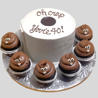 The Toilet Paper B-Day features a cake shaped like a birthday toilet paper roll with "Oh crap, you're 40!" on top, plus six cupcakes topped with smiling poop emoji chocolate frosting—perfect for a fun and quirky celebration!.