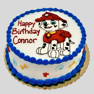Marshall Drawn cake featuring Paw Patrol's Dalmatian with blue icing trim and "Happy Birthday Connor" in red and purple. This custom kids' cake makes any little fan's celebration special.