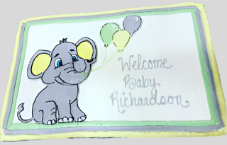 The Elephant Baby cake is a rectangular custom cake with a smiling cartoon elephant baby holding three balloons and "Welcome Baby Richardson" in light gray icing, finished with a light green and yellow border—perfect for an adorable animal-themed celebration.