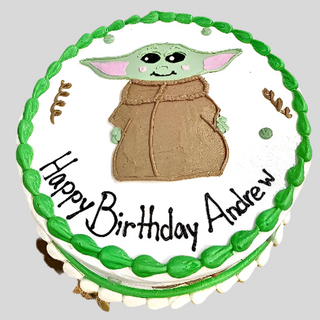 Custom birthday cake with green and white frosting, featuring a drawing of Star Wars Yoda in a brown robe. This fun kids cake says “Happy Birthday Andrew” in black icing. Product: Star Wars Yoda.