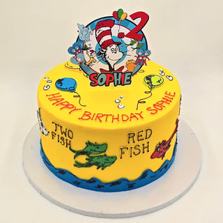 A yellow birthday cake featuring Cat in the Hat Fish characters, a red number 2 topper, and "Happy Birthday Sophie" message.