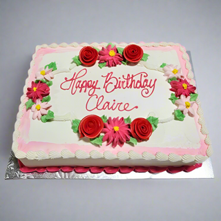 The Flower Scatter birthday cake features pink and red icing flowers, green leaves, white frosting, a pink border, and "Happy Birthday Claire" in pink icing. Custom pricing available.