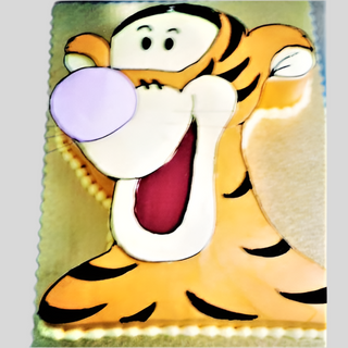 The Tigger Cutout is a custom cake shaped and decorated as Tigger, with orange and black stripes, a pink nose, and a big smile—perfect for kids' parties or as a fun centerpiece.