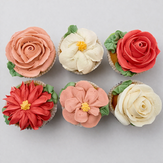 Flower Garden: Six cupcakes decorated with buttercream flowers in pink, red, cream, and white—arranged to resemble roses and dahlias. A unique custom cake alternative for birthdays or baby showers.