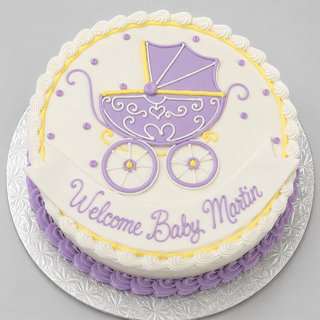 The Carriage Drawn round baby shower cake features a purple and yellow baby carriage design, white icing with purple accents, and a "Welcome Baby Martin" banner, all presented on a silver textured board.