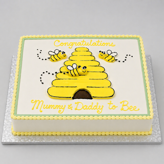 Bee Baby: A rectangular cake with a yellow beehive, three cartoon bees, and “Congratulations Mummy & Daddy to Bee” in yellow icing. Finished with a cheerful yellow and white border—a perfect choice for animal cake lovers!.
