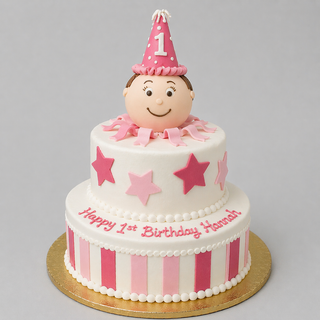 Baby Tier: Two-tier custom cake in white, decorated with pink stars and stripes and topped with a smiling baby in a pink party hat labeled 1. "Happy 1st Birthday Hannah" in pink icing—ideal for birthdays or baby showers.