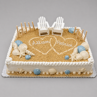 A nautical beach-themed cake decorated with sand-like crumbs, white and blue chocolate seashells, two Adirondack chairs, and Sand Hearts personalized with “Allison” and “Patrick.”.
