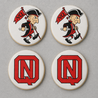 North Quincy Cookies: four round cookies—the top two feature a cartoon colonial soldier with a red "NQ" flag, while the bottom two display a bold red "NQ" monogram on a white background.