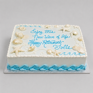 Beach Retirement: A rectangular cake adorned with seashells, starfish, and blue waves, featuring "Enjoy this new wave of life. Happy retirement Julie" written in blue frosting.