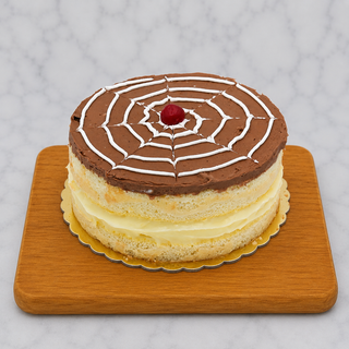 Boston Cream Pie, a layered vanilla sponge cake with chocolate icing in a spiderweb design and a red cherry on top, is displayed on a wooden board against a marble backdrop.