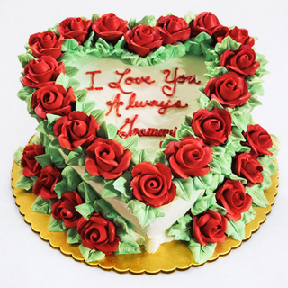 Floral Heart: A heart-shaped cake with red icing roses, green leaves, and "I Love You Always Shammu" in red icing. Perfect for bridal or engagement celebrations, presented on a gold cake board.